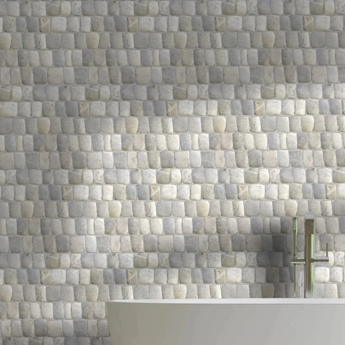 Canine grey tile wall with white bathtub in front of it
