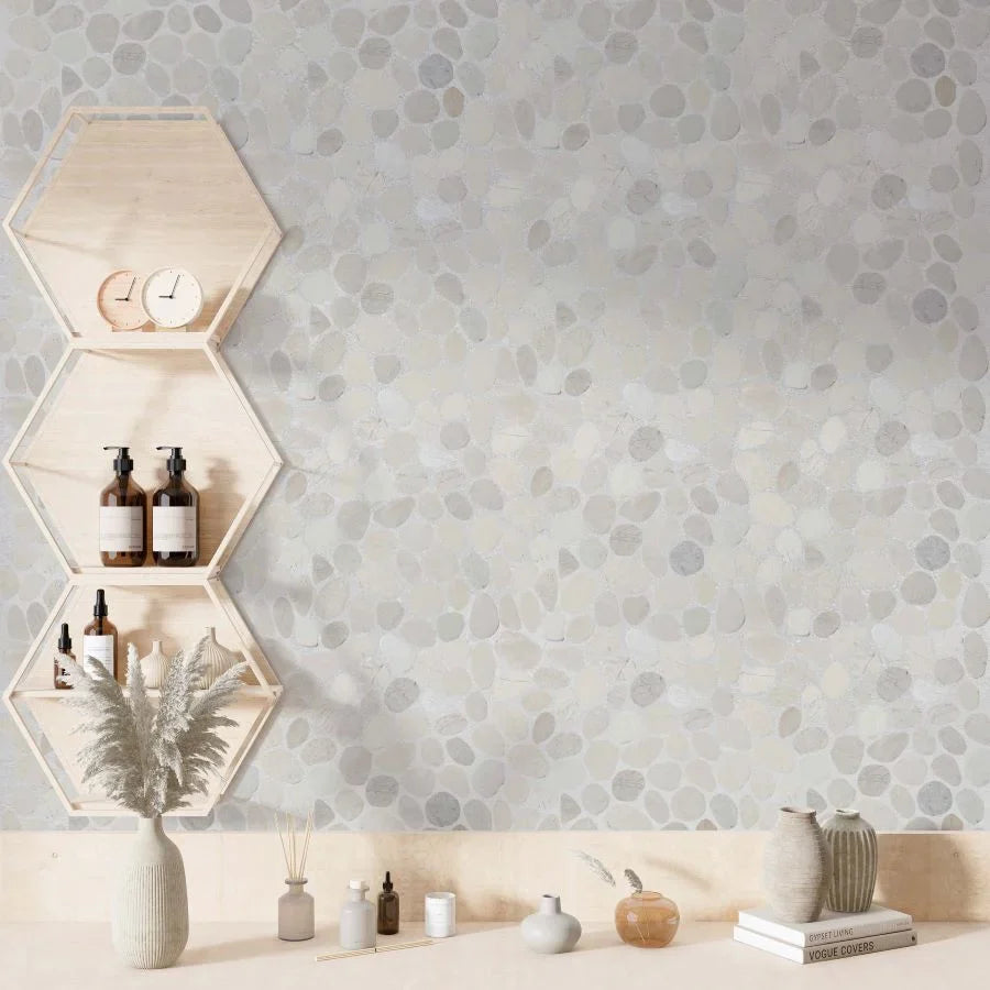 White timor pebble tile bathroom wall surrounded by soft wood accents