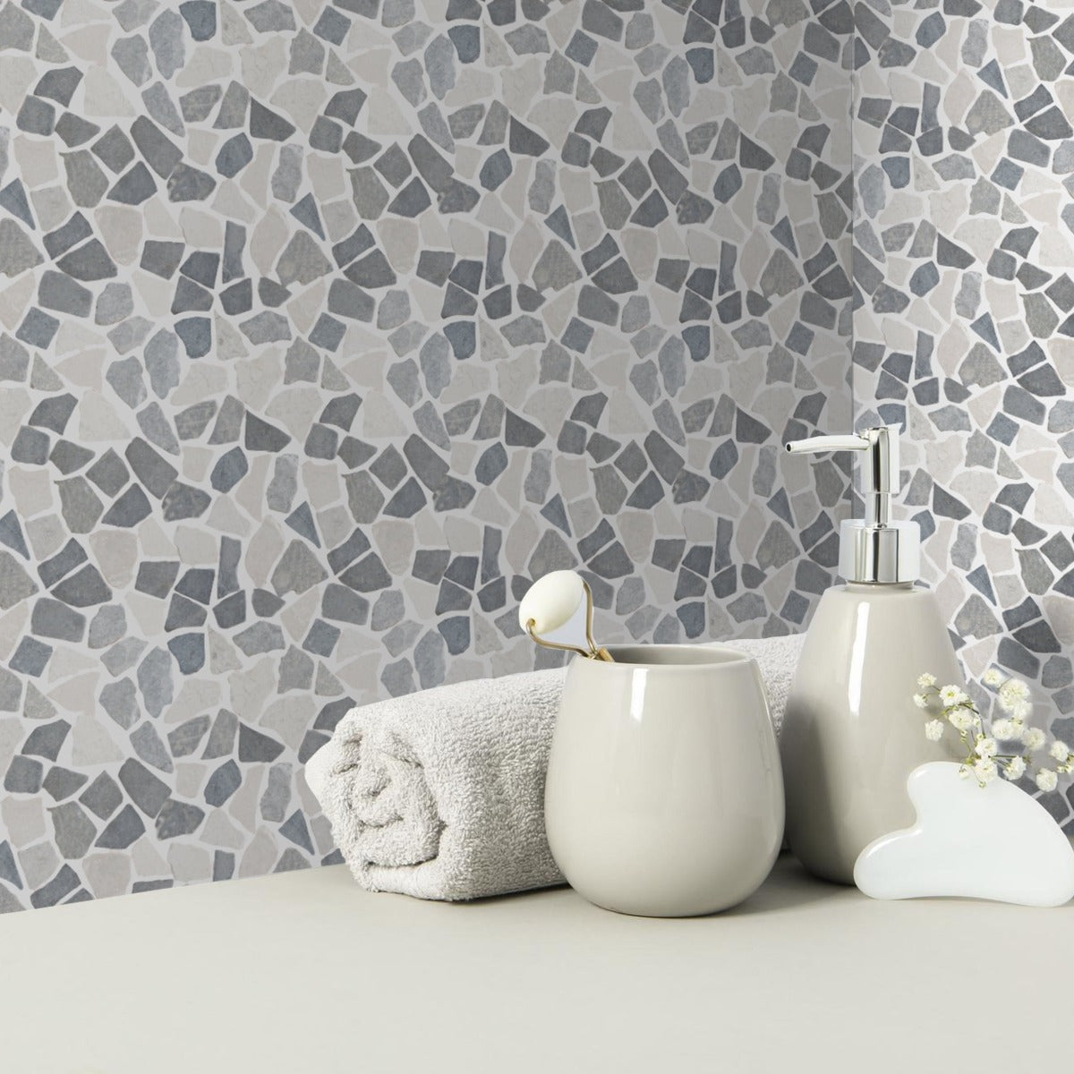 Awan tile wall with rolled towel and soap on counter in front of it