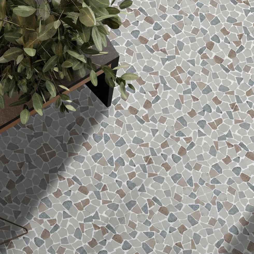 Sea Sand tile flooring with coffee table and small plant on top of the floor