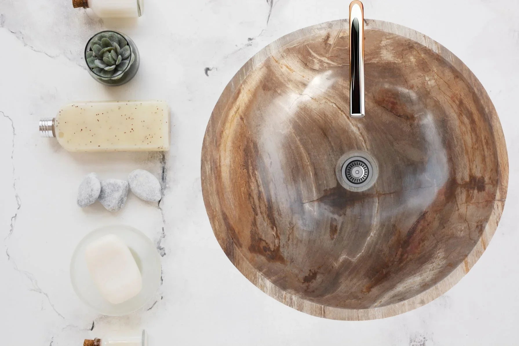 Eclipse Basin on white marble bathroom counter surrounded by soaps